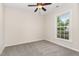 A bedroom with a neutral color palette, ceiling fan and plush carpeting at 9709 Batesville Dr, Raleigh, NC 27617