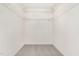 Walk-in closet with carpet floors and built-in metal shelving at 9709 Batesville Dr, Raleigh, NC 27617