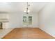 A light-filled dining area features hardwood floors and glass doors leading to the backyard at 9709 Batesville Dr, Raleigh, NC 27617
