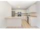 A kitchen with white cabinets and tile floors at 9709 Batesville Dr, Raleigh, NC 27617
