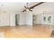 Open living room featuring hardwood floors, bright interior and French doors at 9709 Batesville Dr, Raleigh, NC 27617