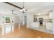 A view of the open floor plan, with hardwood floors and the kitchen to the right at 9709 Batesville Dr, Raleigh, NC 27617
