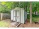 Backyard storage shed with double doors at 9709 Batesville Dr, Raleigh, NC 27617