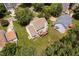 Aerial view of the home showcases the backyard, deck, and surrounding greenery at 9728 Batesville Dr, Raleigh, NC 27617