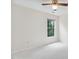 Neutral bedroom with a window providing ample natural light and plush carpet at 9728 Batesville Dr, Raleigh, NC 27617