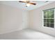 Neutral bedroom featuring carpet and a window to let in natural light at 9728 Batesville Dr, Raleigh, NC 27617
