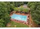 Aerial view of a community pool with lounge chairs and a covered seating area at 9728 Batesville Dr, Raleigh, NC 27617