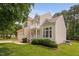Beautiful home exterior with manicured lawn, complementing shrubbery and a two-car garage at 9728 Batesville Dr, Raleigh, NC 27617