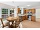 Inviting kitchen with oak cabinets, modern appliances and a cozy breakfast nook at 9728 Batesville Dr, Raleigh, NC 27617
