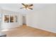 Living room featuring hardwood floors, neutral paint, and a passthrough to the kitchen at 9728 Batesville Dr, Raleigh, NC 27617
