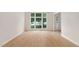 Bright living room with a large window, neutral walls, and hardwood flooring at 9728 Batesville Dr, Raleigh, NC 27617