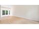 Spacious living room featuring hardwood floors, neutral colors, and bay window at 9728 Batesville Dr, Raleigh, NC 27617