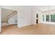 Open living room showcasing natural light, hardwood floors and neutral paint colors at 9728 Batesville Dr, Raleigh, NC 27617