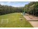 Spacious community park with a soccer field and modern playground equipment at 9728 Batesville Dr, Raleigh, NC 27617