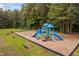 Charming community playground featuring colorful slides, swings, and climbing structures at 9728 Batesville Dr, Raleigh, NC 27617