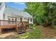 Spacious backyard with deck, lush trees and plantings at 1003 Blackberry Ln, Durham, NC 27712