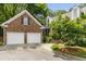Lovely brick home with a two-car garage and a manicured front yard at 1003 Blackberry Ln, Durham, NC 27712