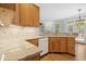 Open kitchen featuring granite countertops, tile backsplash, hardwood floors, and stainless steel appliances at 1003 Blackberry Ln, Durham, NC 27712