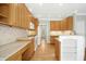 Bright kitchen features granite countertops, hardwood floors, stainless steel appliances, and ample cabinet space at 1003 Blackberry Ln, Durham, NC 27712