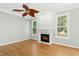 Bright living room featuring a fireplace and hardwood floors at 1003 Blackberry Ln, Durham, NC 27712