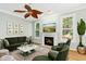 Cozy living room with fireplace, plush seating, and natural light at 1003 Blackberry Ln, Durham, NC 27712