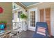 Inviting back porch with comfortable lounge chair and outdoor decor at 1009 Iredell St # D, Durham, NC 27705