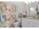 Bathroom featuring granite countertop, and shower with patterned curtain at 1009 Iredell St # D, Durham, NC 27705