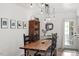 Dining room with wooden table, seating for six, and modern lighting fixtures at 1009 Iredell St # D, Durham, NC 27705