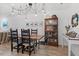 Dining room offers seating for six, wooden table, and modern lighting at 1009 Iredell St # D, Durham, NC 27705