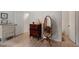 Hallway features wood floors, dressers, and decorative mirror at 1009 Iredell St # D, Durham, NC 27705