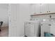 Well-lit laundry room with side-by-side washer and dryer at 1009 Iredell St # D, Durham, NC 27705