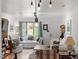 Cozy living room with bright lighting, multiple seats, and views to the outdoors at 1009 Iredell St # D, Durham, NC 27705