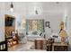 Living room boasts natural light, hardwood floors, bright colors, and a television at 1009 Iredell St # D, Durham, NC 27705
