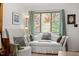 Living room features hardwood floors, bright light, and light-colored furniture at 1009 Iredell St # D, Durham, NC 27705
