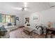 Bright living room features hardwood floors, white couches, and a view to the outside at 1009 Iredell St # D, Durham, NC 27705