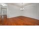 Bright dining room with hardwood floors and chandelier at 1016 Kingston Grove Dr, Cary, NC 27519
