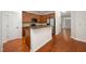 Well-lit kitchen features stainless steel appliances, wooden cabinets, and hardwood floors at 1016 Kingston Grove Dr, Cary, NC 27519