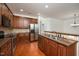 Charming kitchen with stainless steel appliances, granite countertops, and wooden cabinets at 1016 Kingston Grove Dr, Cary, NC 27519