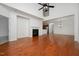 Open living room features hardwood floors, large windows, fireplace, and high ceilings at 1016 Kingston Grove Dr, Cary, NC 27519