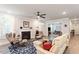 Cozy living room featuring a fireplace, hardwood floors, comfortable seating, and ample natural light at 10310 Sablewood Dr # 115, Raleigh, NC 27617