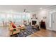 Inviting living area with hardwood floors, white trim, fireplace, and comfortable seating at 10310 Sablewood Dr # 115, Raleigh, NC 27617