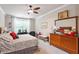 Spacious main bedroom shows natural light, dresser, and a king-size bed at 10310 Sablewood Dr # 115, Raleigh, NC 27617