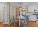 Cozy breakfast nook featuring stylish lighting and backyard access, perfect for enjoying casual meals at 1033 Mills St, Raleigh, NC 27608