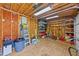 Functional garage with shelving, workbench, and ample space for storage or projects at 1033 Mills St, Raleigh, NC 27608