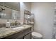 Bright bathroom featuring a granite vanity and shower with chrome fixtures at 104 S Tunstall St, Apex, NC 27502