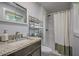Bathroom with granite vanity top and a walk-in shower at 104 S Tunstall St, Apex, NC 27502