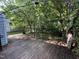 Wooden deck in fenced in backyard with overhead sunshade framework at 10415 Neland, Raleigh, NC 27614