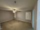 Bedroom view with carpet floors, ceiling fan, and shuttered windows at 10415 Neland, Raleigh, NC 27614