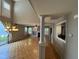Inviting living room boasts hardwood floors, large windows for natural light, and an open layout leading to other living spaces at 10415 Neland, Raleigh, NC 27614