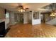 Expansive living area showcasing hardwood floors, a fireplace, an open layout, and ample natural light at 10415 Neland, Raleigh, NC 27614